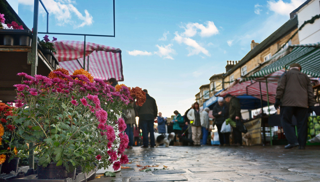 Image of Otley Market Place, shot from below to show market stalls